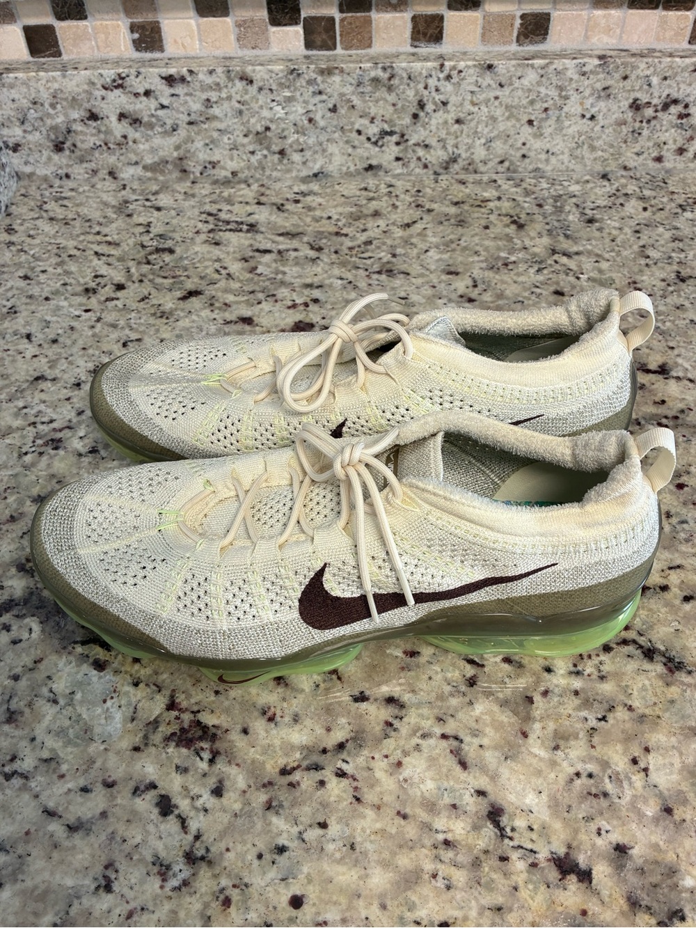 Nike Air VaporMax 2023 Flyknit shoes in Coconut Milk and Neutral Olive color Way